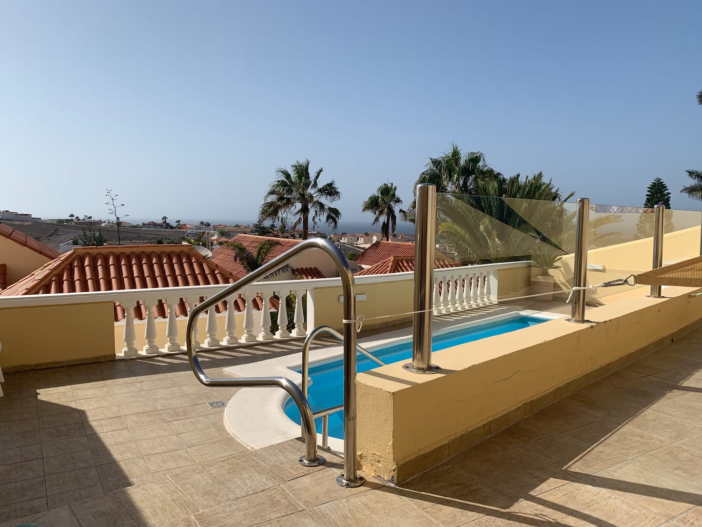 Patio with steps down to the pool